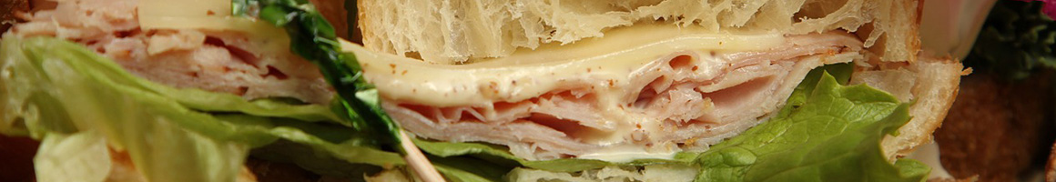 Eating Deli Sandwich Cafe Salad at Rising Roll Gourmet Cafe' restaurant in Atlanta, GA.